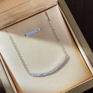 Bella Moissanite Necklace with curved bar and round stones on gold chain