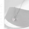 Derin Moissanite Necklace and Stud Earrings Set in sterling silver – displayed on white arch background