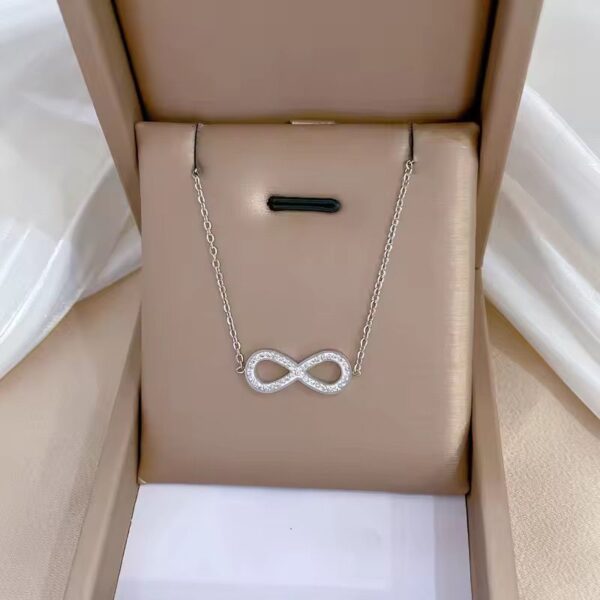 Sterling Silver Infinity Pendant Necklace with crystal accents on a dainty chain – symbolic and elegant design