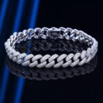 Sterling silver moissanite Cuban link tennis bracelet on reflective black surface