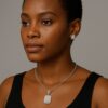 Rose Moissanite Necklace and Earring Set with Emerald Cut Stones on black model