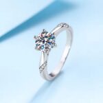 Wunmi Moissanite Sterling Silver Engagement Ring with Round-Cut Stone and CZ Side Accents