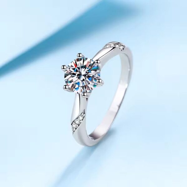 Wunmi Moissanite Sterling Silver Engagement Ring with Round-Cut Stone and CZ Side Accents